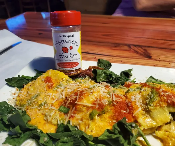 Habanero Shaker with food — 30+ Years Strong